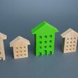 Green residential building among houses. Environmentally friendly, energy efficient and zero carbon emissions. Search for the best option to buy an apartment. Net Zero Carbon neutrality. High quality