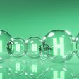 Green hydrogen energy. H2 gas molecules for production of green hydrogen energy. Renewable or sustainable electricity. Clean alternative ecological energy. 3D rendering.