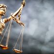 Legal law concept statue of Lady Justice with scales of justice