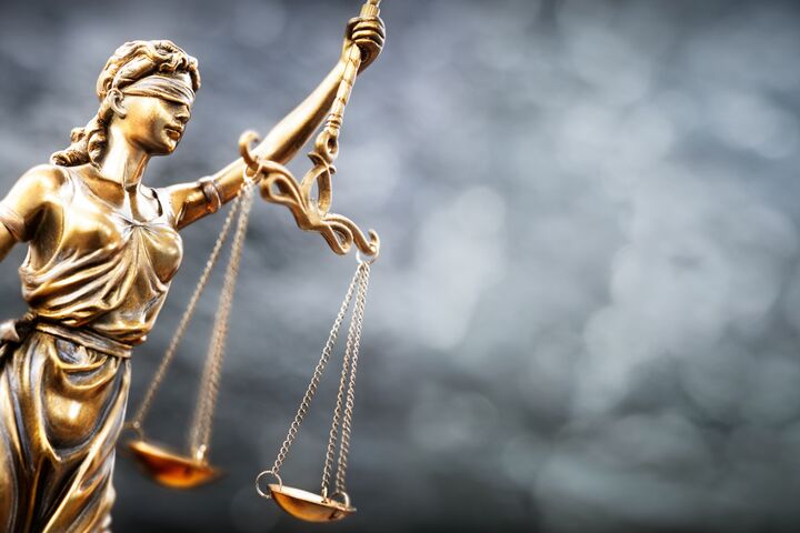 Legal law concept statue of Lady Justice with scales of justice