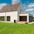 Shot of a white single-family detached house
