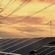 electricity power in nature. clean energy concept. solar panel with turbine and tower hight voltage