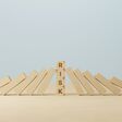 Risk management concept. Wooden block stopping domino effect for business. 3d render illustration