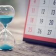 Hour glass and calendar concept for time slipping away for important appointment date, schedule and deadline