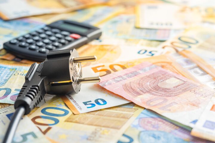 Electric plug, calculator and euro money. Concept of the increasing electricity prices.