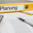 Aktenordner mit der Beschriftung Planung