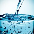 closeup of a refreshing glass of water which is being filled